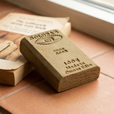 CBD hash on top of a book and a stone surface