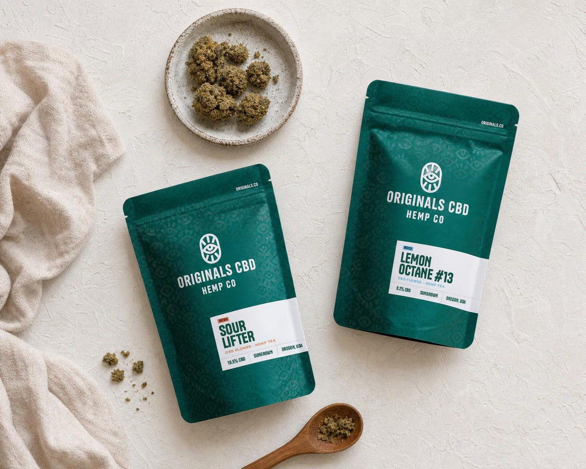 green bags on a cream background, with cbd flower on a plate, neutral lighting with cloth and spoon 